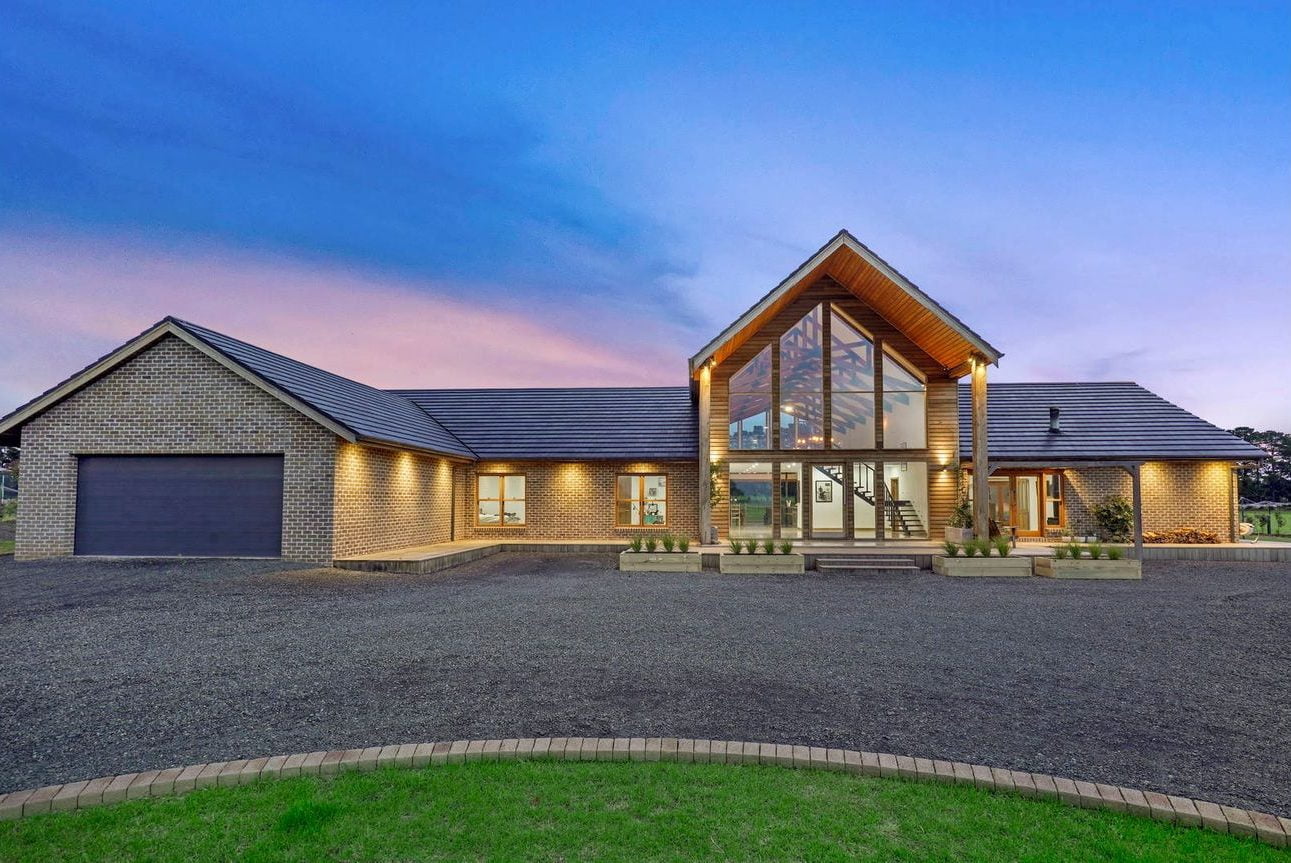 Spacious living area with floor-to-ceiling windows and modern furnishings in a luxurious new build home in Melbourne. This is a Wow House!