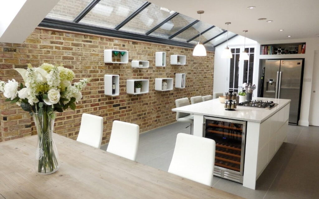 A home with a rear extension, side extension, double storey extension, and conservatory. The extensions are shown in different colours and styles.