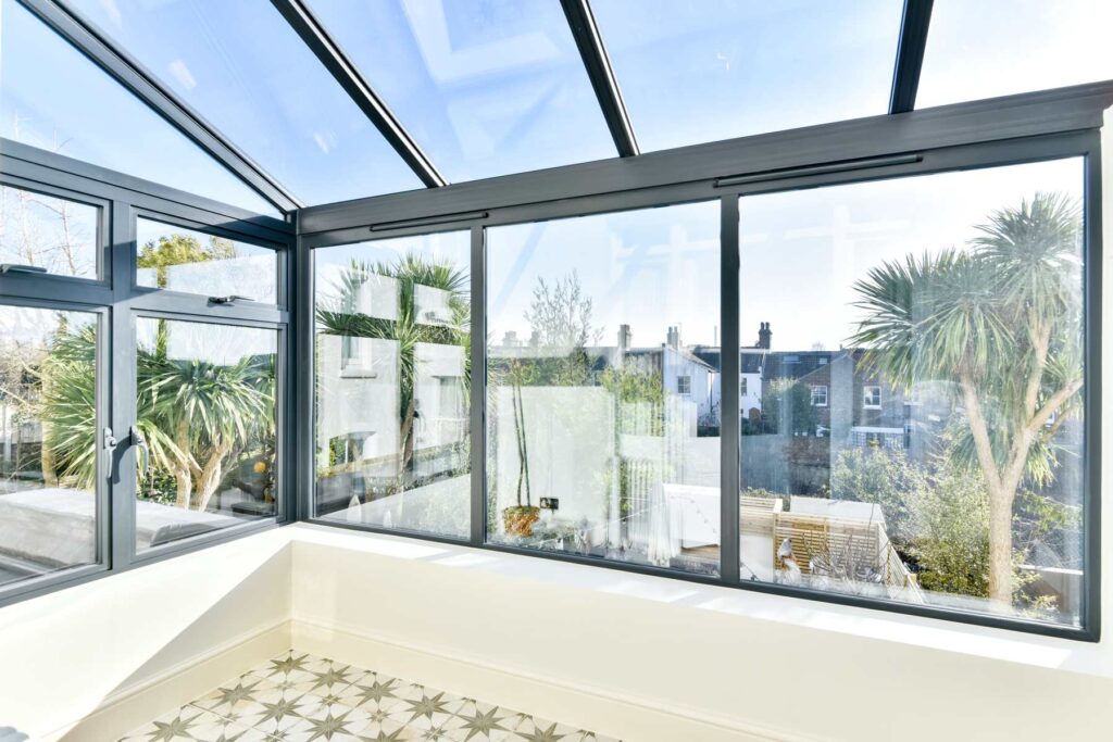 An elegant and stylish conservatory with a modern roof conversion, creating a comfortable and inviting space.