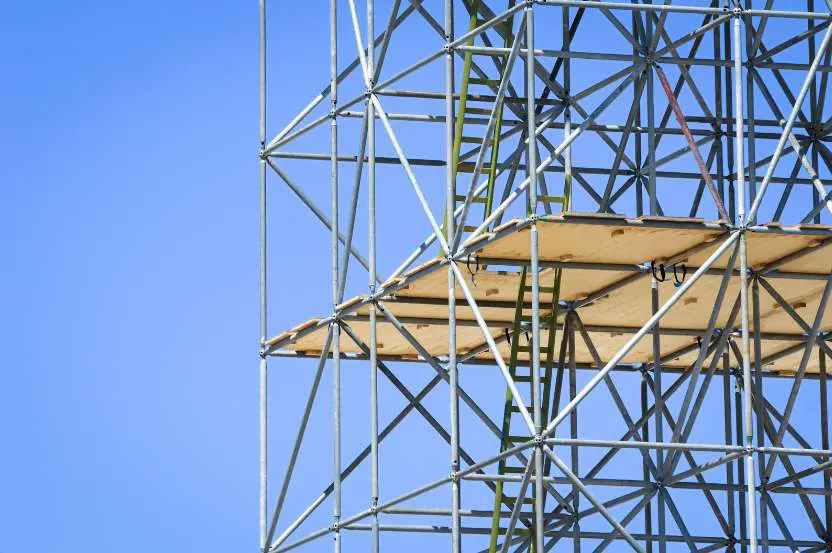 A construction site showcasing scaffolding framework, representative of the subject matter discussed in our blog post about scaffolding rights and regulations in the UK