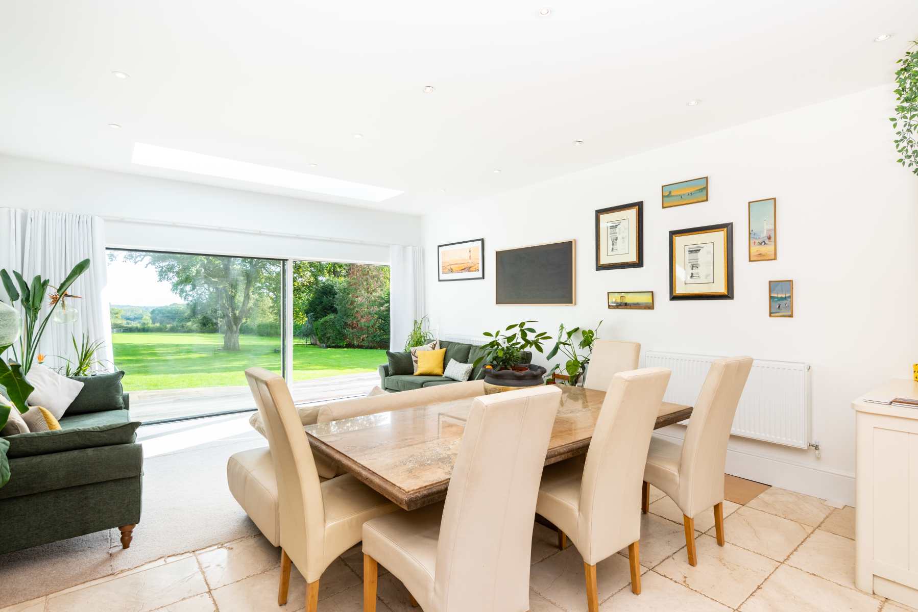 Interior view of a newly renovated dining room with contemporary decor and natural light.