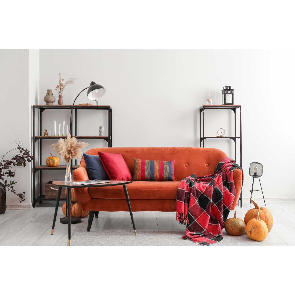 Interior decor reflecting Autumn design trends for 2023 with earthy colours, eco-friendly elements, and cosy living space ideas.